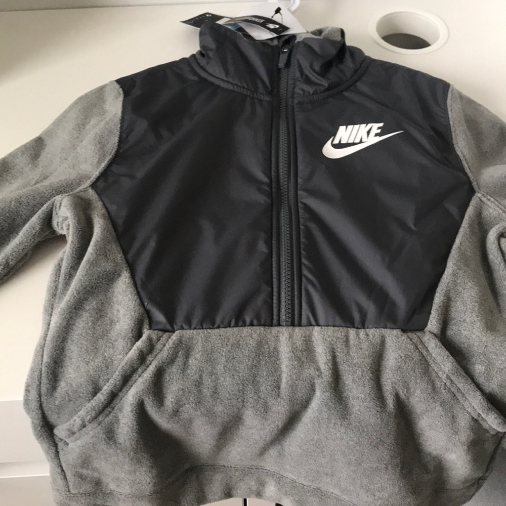 Brand new boys two pocket Nike fleece jacket.